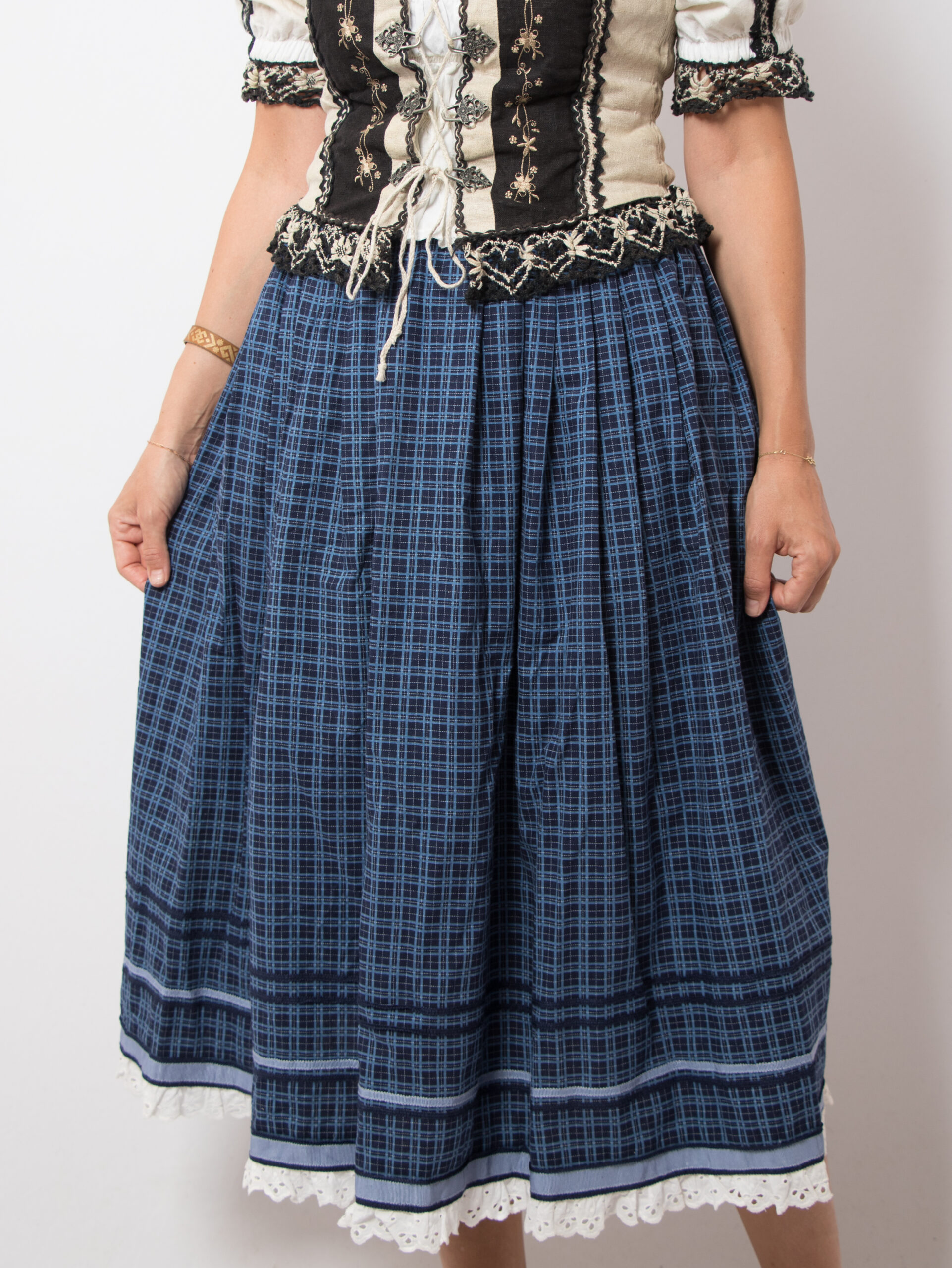 Vintage Folk Blue Plaid Skirt Vintage folk skirt in traditional dirndl style, made from pure cotton, lining acetat. Features a blue base with plaid print. High-waisted, side pockets, and a back zip closure. Classic alpine look in excellent vintage condition. Size XS, see the measures below. m e a s u r e m e n t s (taken while the item is lying flat): waist: 23.5'/ 60 cm length: 33.4'/ 85 cm (Measurements of armpit, waist, and hips are doubled)